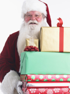 Santa Claus with Armload of Presents --- Image by © Royalty-Free/Corbis